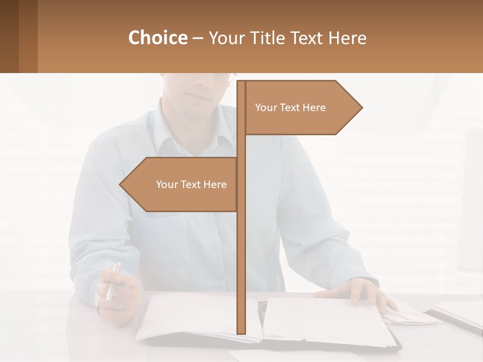 A Man Sitting At A Desk In Front Of A Computer PowerPoint Template