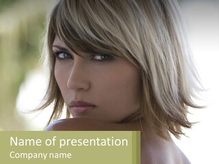 A Woman With Blonde Hair Is Looking At The Camera PowerPoint Template