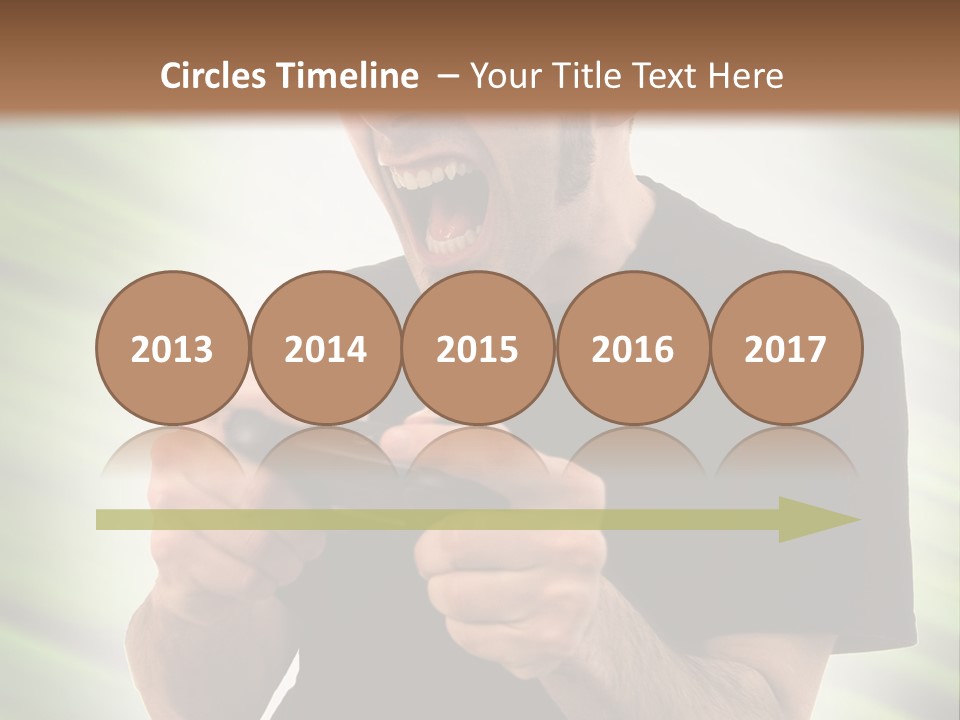 A Man Holding A Remote Control In His Hand PowerPoint Template