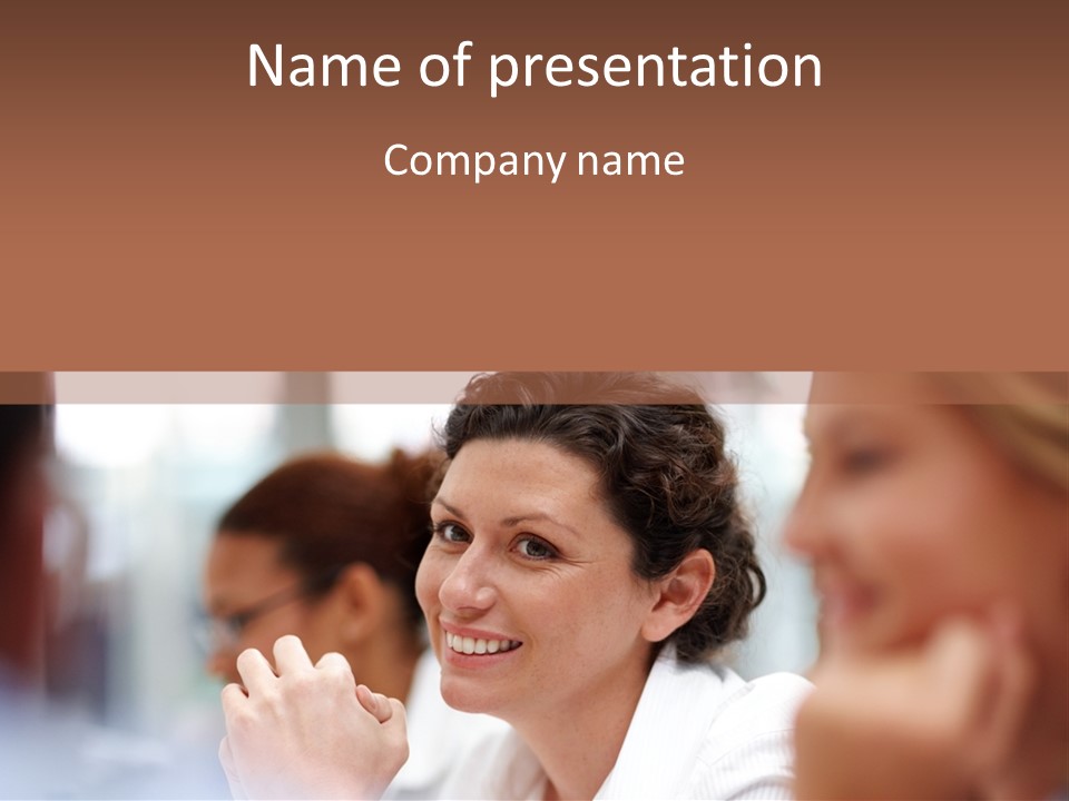 A Woman Sitting At A Table With A Smile On Her Face PowerPoint Template