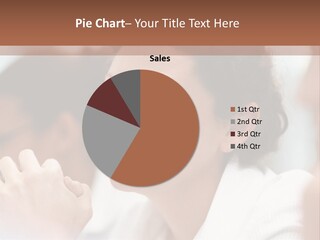 A Woman Sitting At A Table With A Smile On Her Face PowerPoint Template