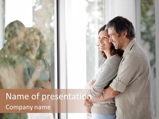 A Man And Woman Standing Next To Each Other In Front Of A Window PowerPoint Template