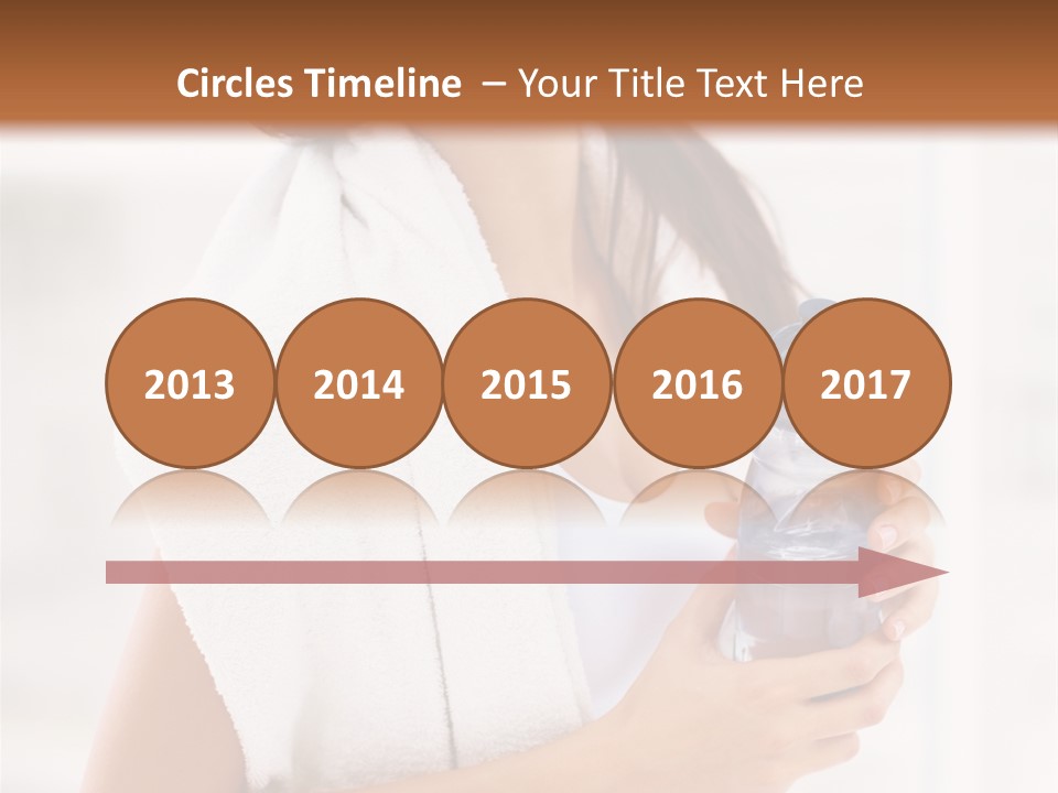 A Woman Holding A Bottle Of Water In Her Hand PowerPoint Template