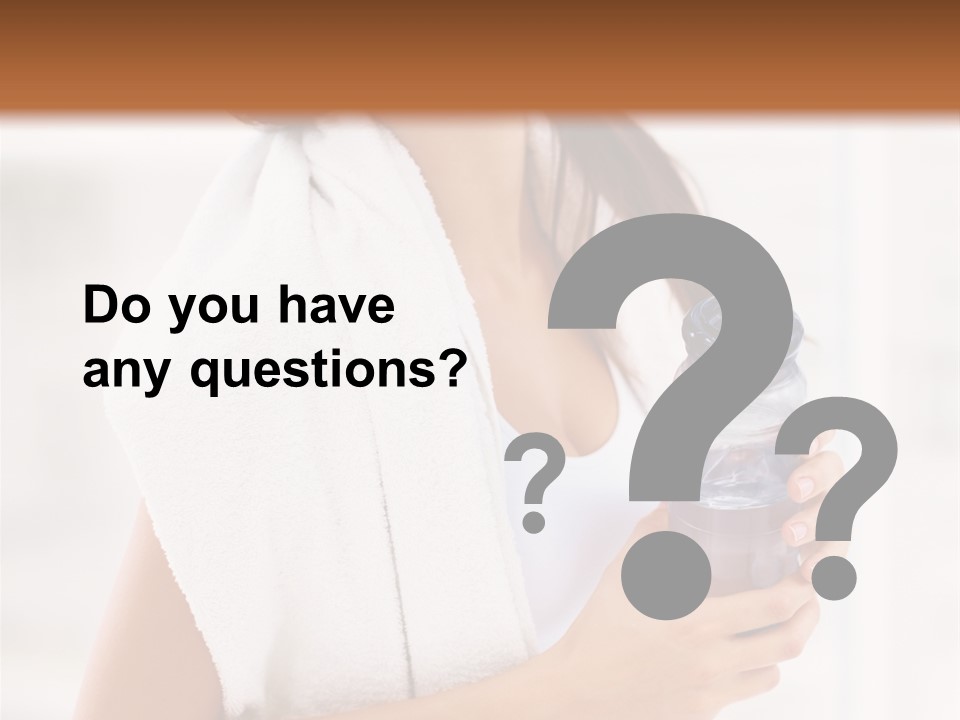 A Woman Holding A Bottle Of Water In Her Hand PowerPoint Template