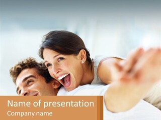 A Man And Woman Laying On A Bed With Their Arms Around Each Other PowerPoint Template