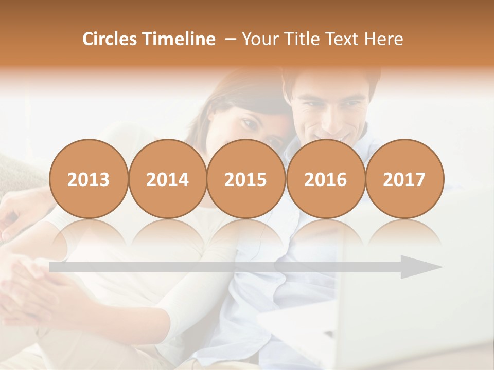 A Man And Woman Sitting On A Couch Looking At A Laptop PowerPoint Template