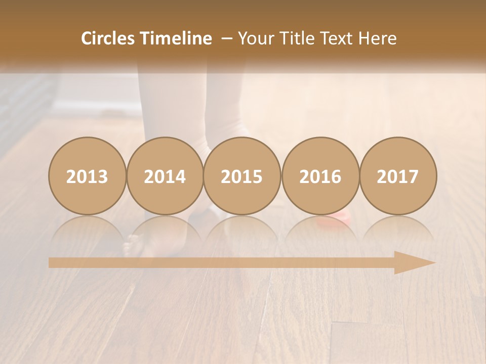 A Person Standing On A Wooden Floor Next To An Orange Object PowerPoint Template