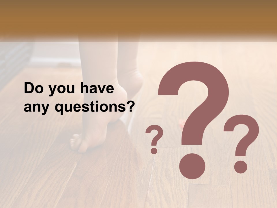 A Person Standing On A Wooden Floor Next To An Orange Object PowerPoint Template