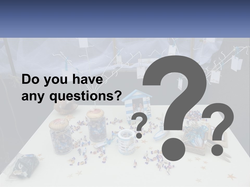 A Table Topped With Lots Of Items On Top Of A White Table PowerPoint Template