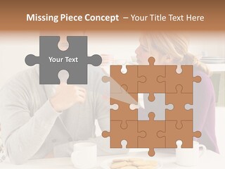 A Man And Woman Sitting At A Table Talking PowerPoint Template