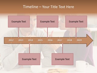 A Man And Woman Sitting At A Table Talking PowerPoint Template