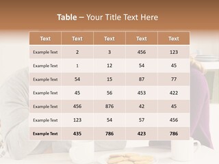A Man And Woman Sitting At A Table Talking PowerPoint Template