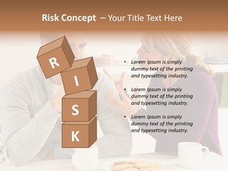 A Man And Woman Sitting At A Table Talking PowerPoint Template