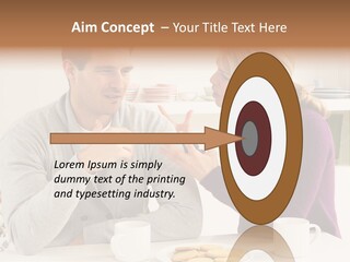 A Man And Woman Sitting At A Table Talking PowerPoint Template