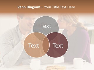 A Man And Woman Sitting At A Table Talking PowerPoint Template