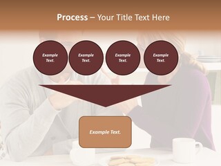 A Man And Woman Sitting At A Table Talking PowerPoint Template