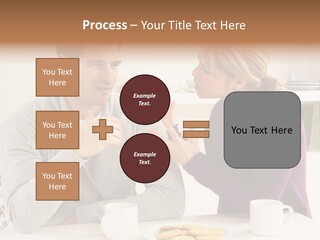 A Man And Woman Sitting At A Table Talking PowerPoint Template