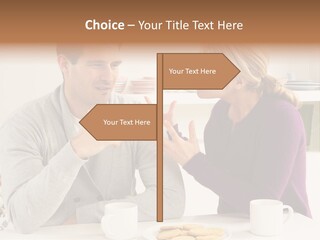 A Man And Woman Sitting At A Table Talking PowerPoint Template
