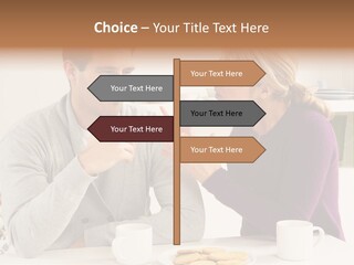 A Man And Woman Sitting At A Table Talking PowerPoint Template
