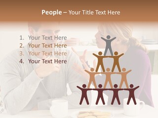 A Man And Woman Sitting At A Table Talking PowerPoint Template