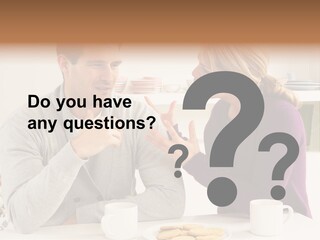 A Man And Woman Sitting At A Table Talking PowerPoint Template