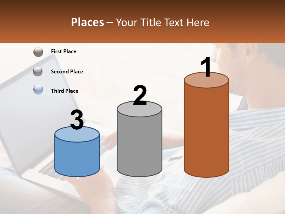 A Man Sitting On A Couch Using A Laptop Computer PowerPoint Template
