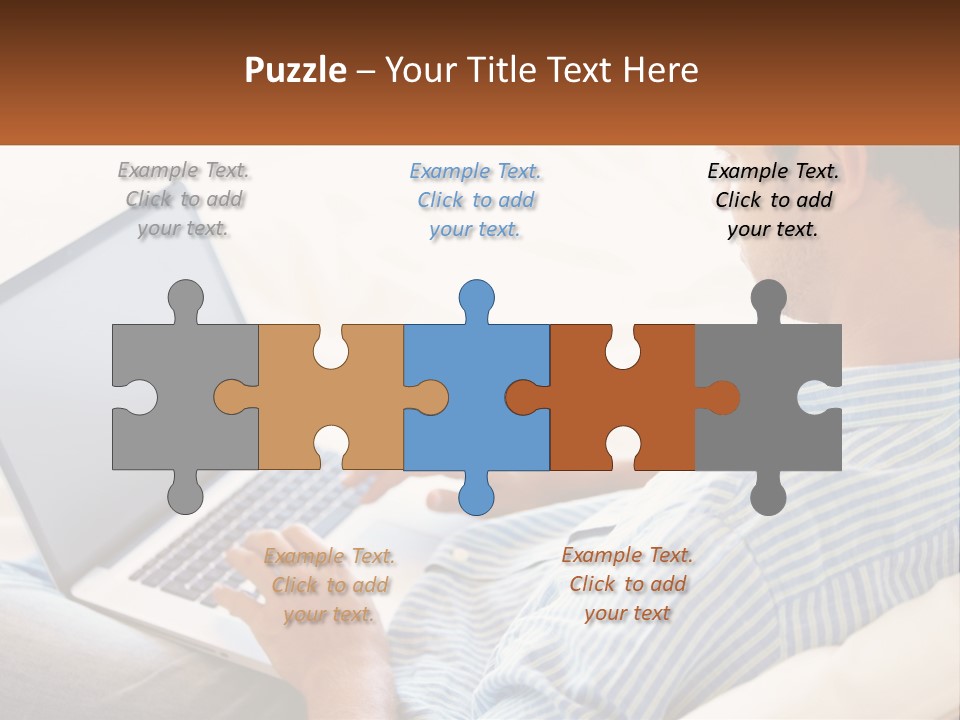 A Man Sitting On A Couch Using A Laptop Computer PowerPoint Template