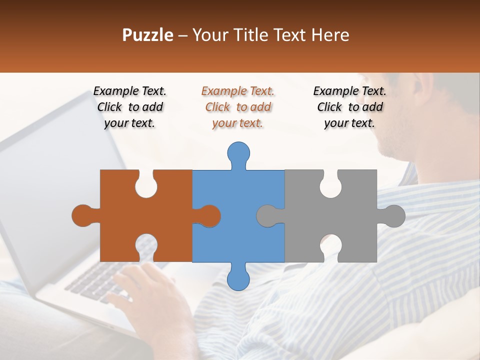 A Man Sitting On A Couch Using A Laptop Computer PowerPoint Template