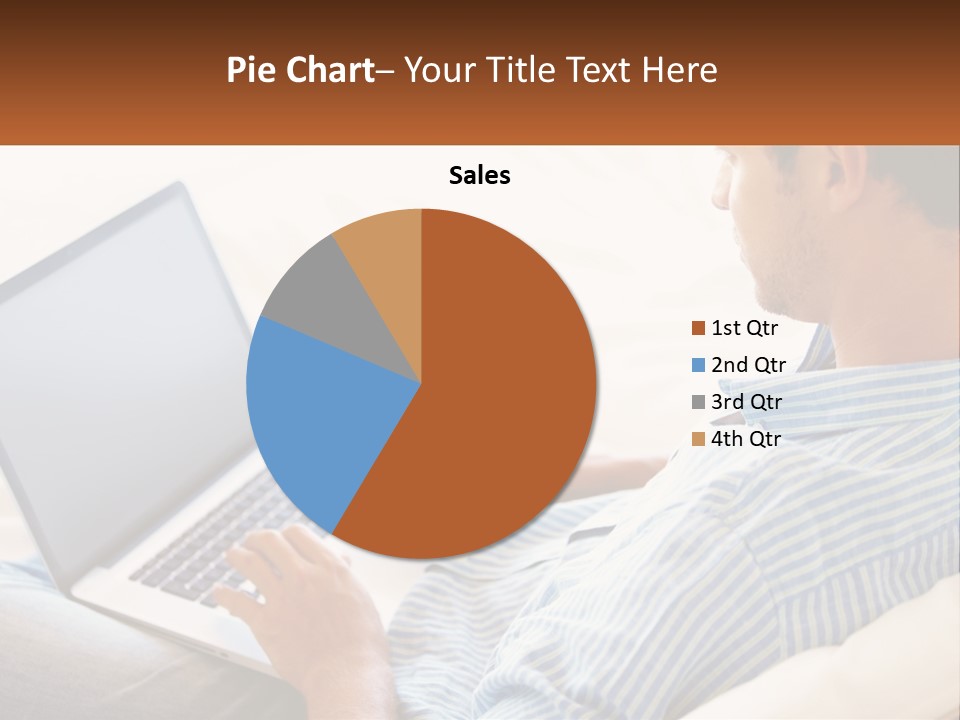A Man Sitting On A Couch Using A Laptop Computer PowerPoint Template