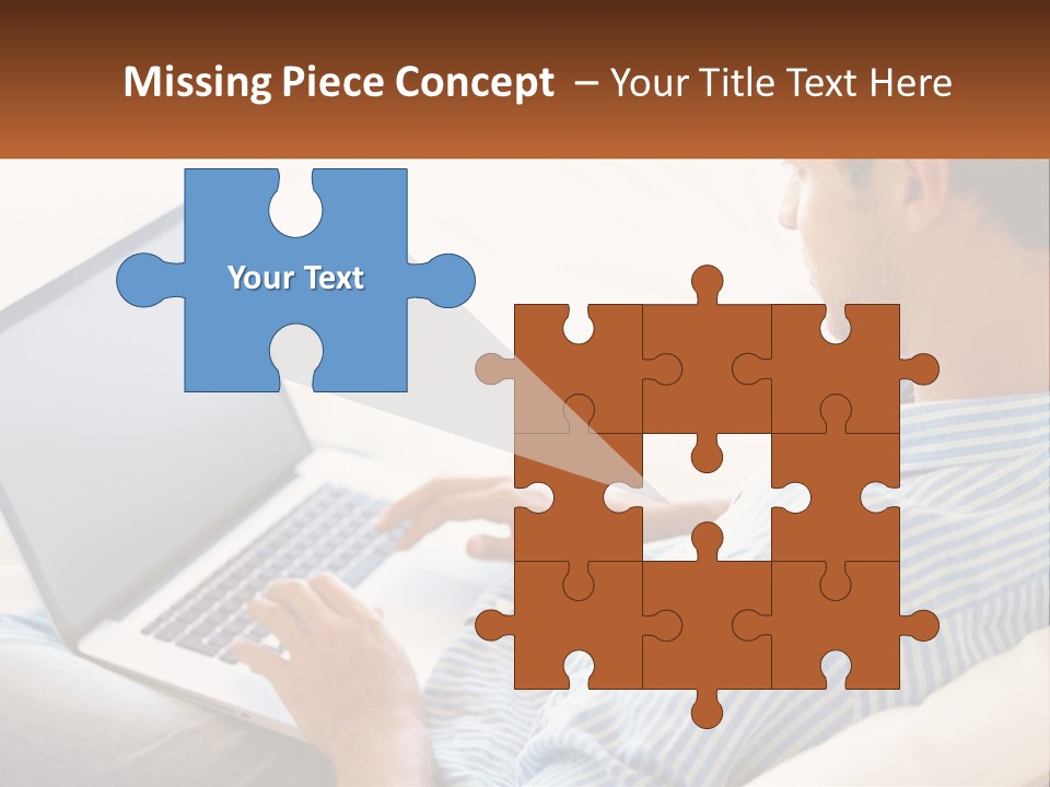 A Man Sitting On A Couch Using A Laptop Computer PowerPoint Template