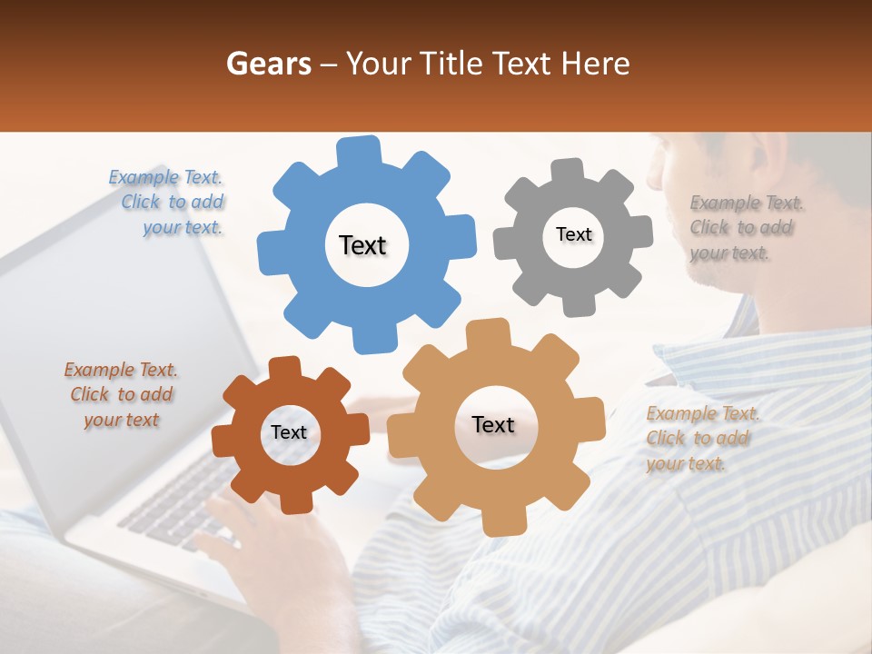 A Man Sitting On A Couch Using A Laptop Computer PowerPoint Template