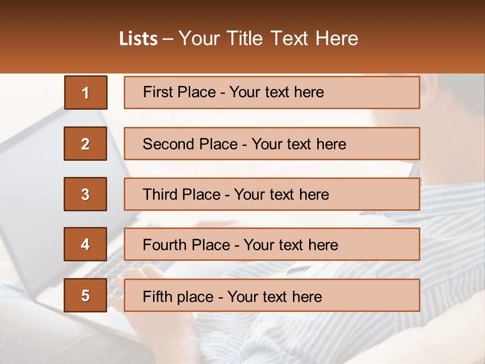 A Man Sitting On A Couch Using A Laptop Computer PowerPoint Template