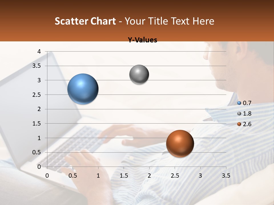 A Man Sitting On A Couch Using A Laptop Computer PowerPoint Template