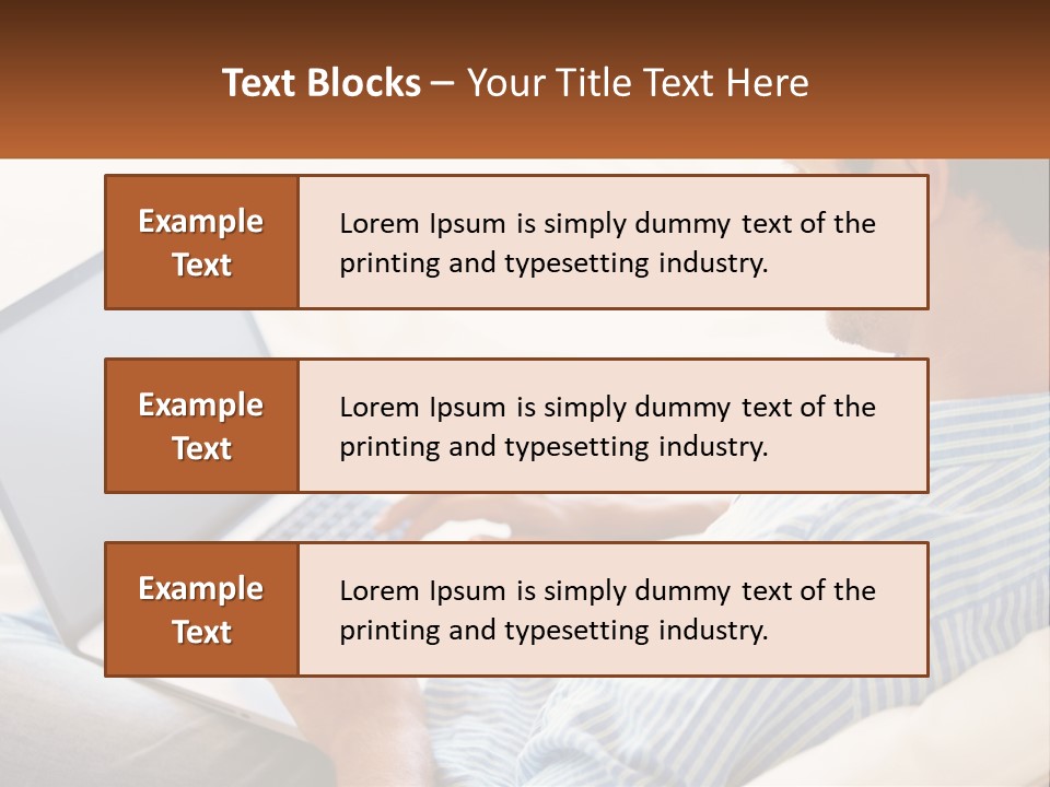 A Man Sitting On A Couch Using A Laptop Computer PowerPoint Template