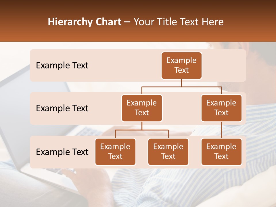 A Man Sitting On A Couch Using A Laptop Computer PowerPoint Template