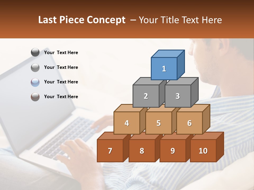 A Man Sitting On A Couch Using A Laptop Computer PowerPoint Template