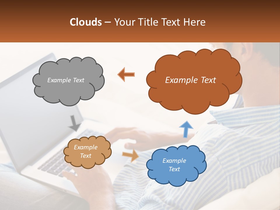 A Man Sitting On A Couch Using A Laptop Computer PowerPoint Template