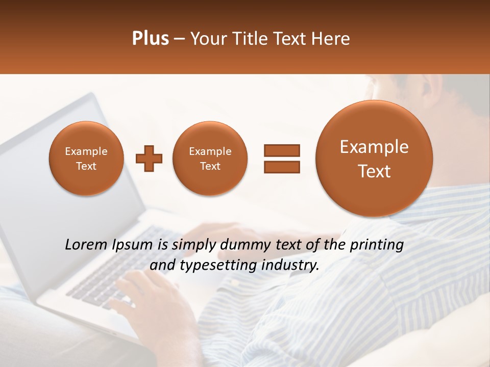A Man Sitting On A Couch Using A Laptop Computer PowerPoint Template