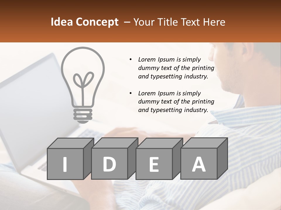 A Man Sitting On A Couch Using A Laptop Computer PowerPoint Template