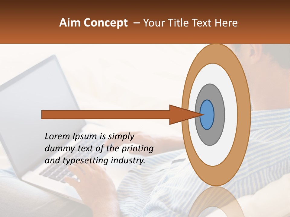 A Man Sitting On A Couch Using A Laptop Computer PowerPoint Template