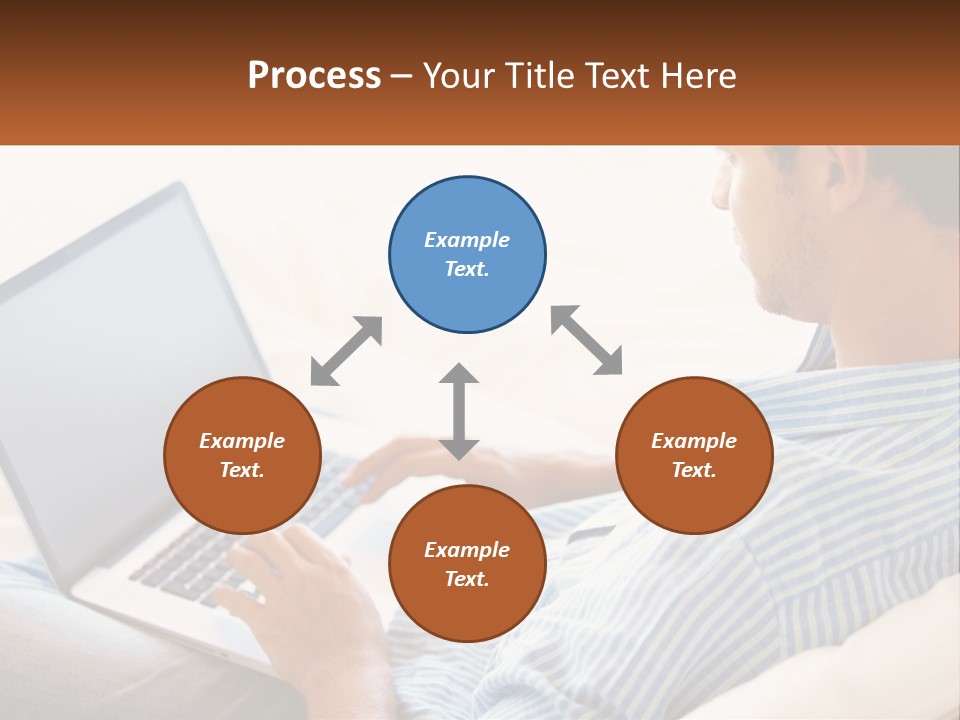 A Man Sitting On A Couch Using A Laptop Computer PowerPoint Template