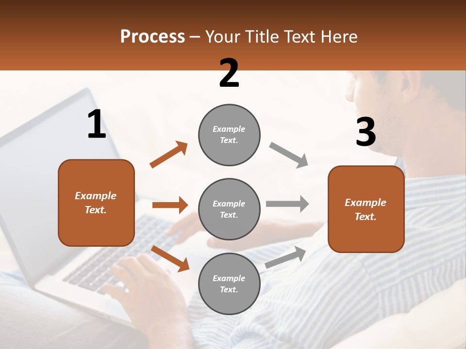 A Man Sitting On A Couch Using A Laptop Computer PowerPoint Template