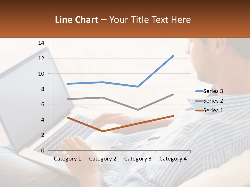 A Man Sitting On A Couch Using A Laptop Computer PowerPoint Template