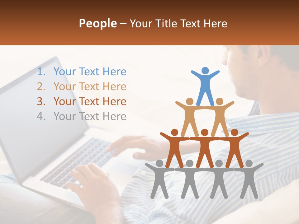 A Man Sitting On A Couch Using A Laptop Computer PowerPoint Template