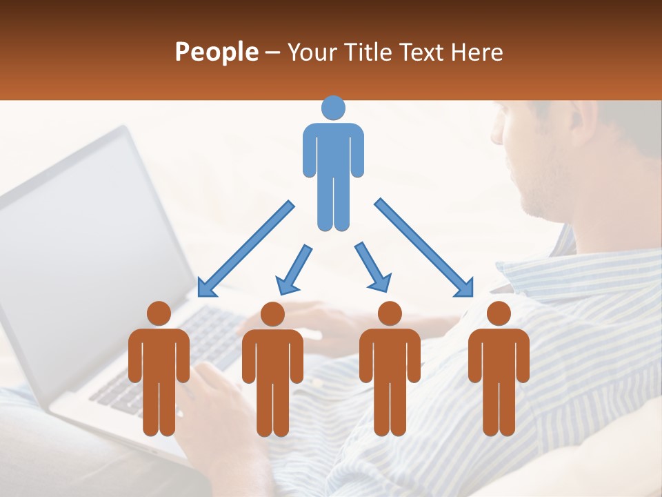 A Man Sitting On A Couch Using A Laptop Computer PowerPoint Template