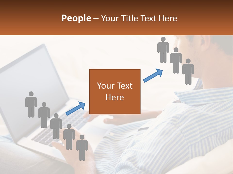 A Man Sitting On A Couch Using A Laptop Computer PowerPoint Template