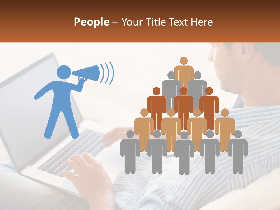 A Man Sitting On A Couch Using A Laptop Computer PowerPoint Template