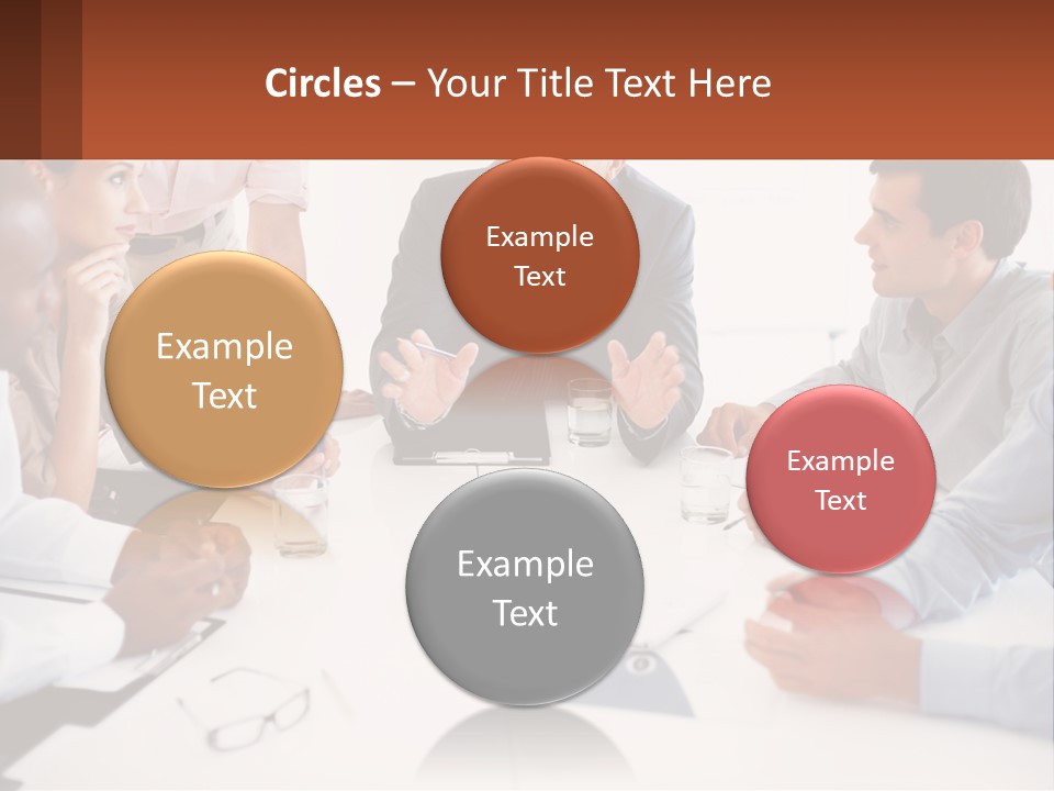 A Group Of People Sitting Around A Table Talking PowerPoint Template