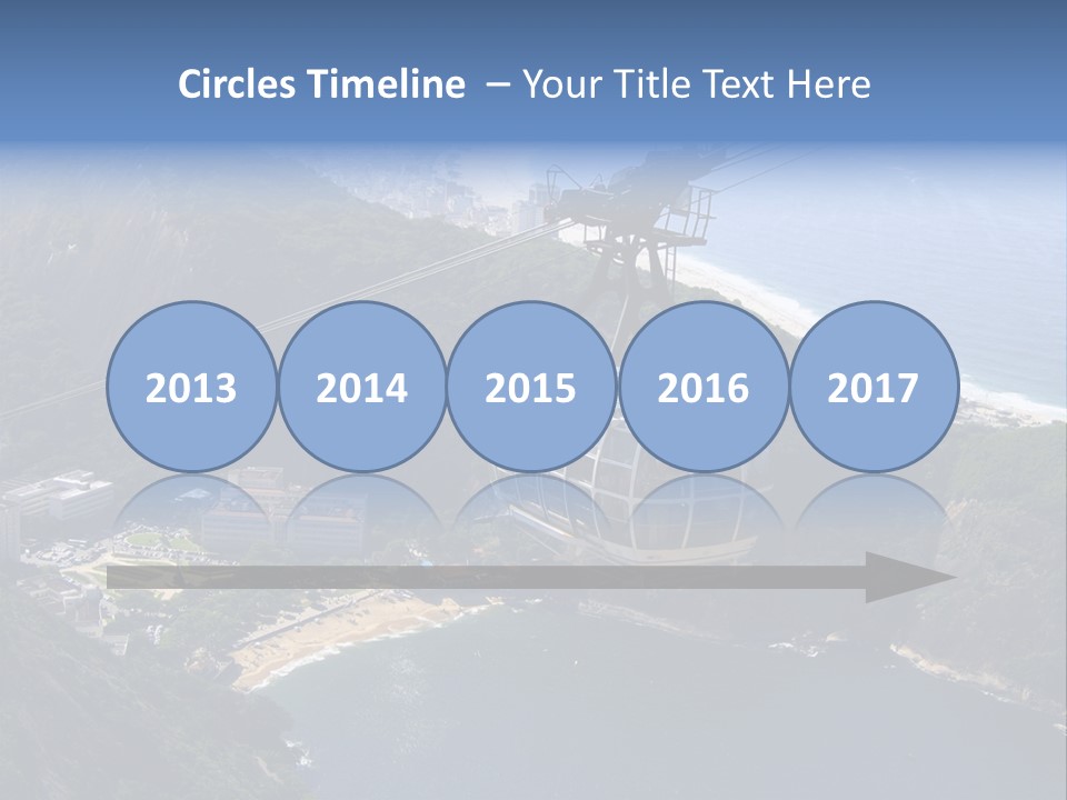 A Cable Car Going Up A Mountain With A City In The Background PowerPoint Template