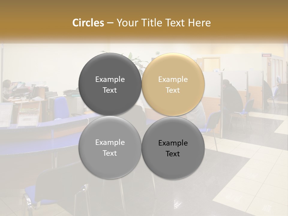 A Group Of People Sitting At Desks In An Office PowerPoint Template